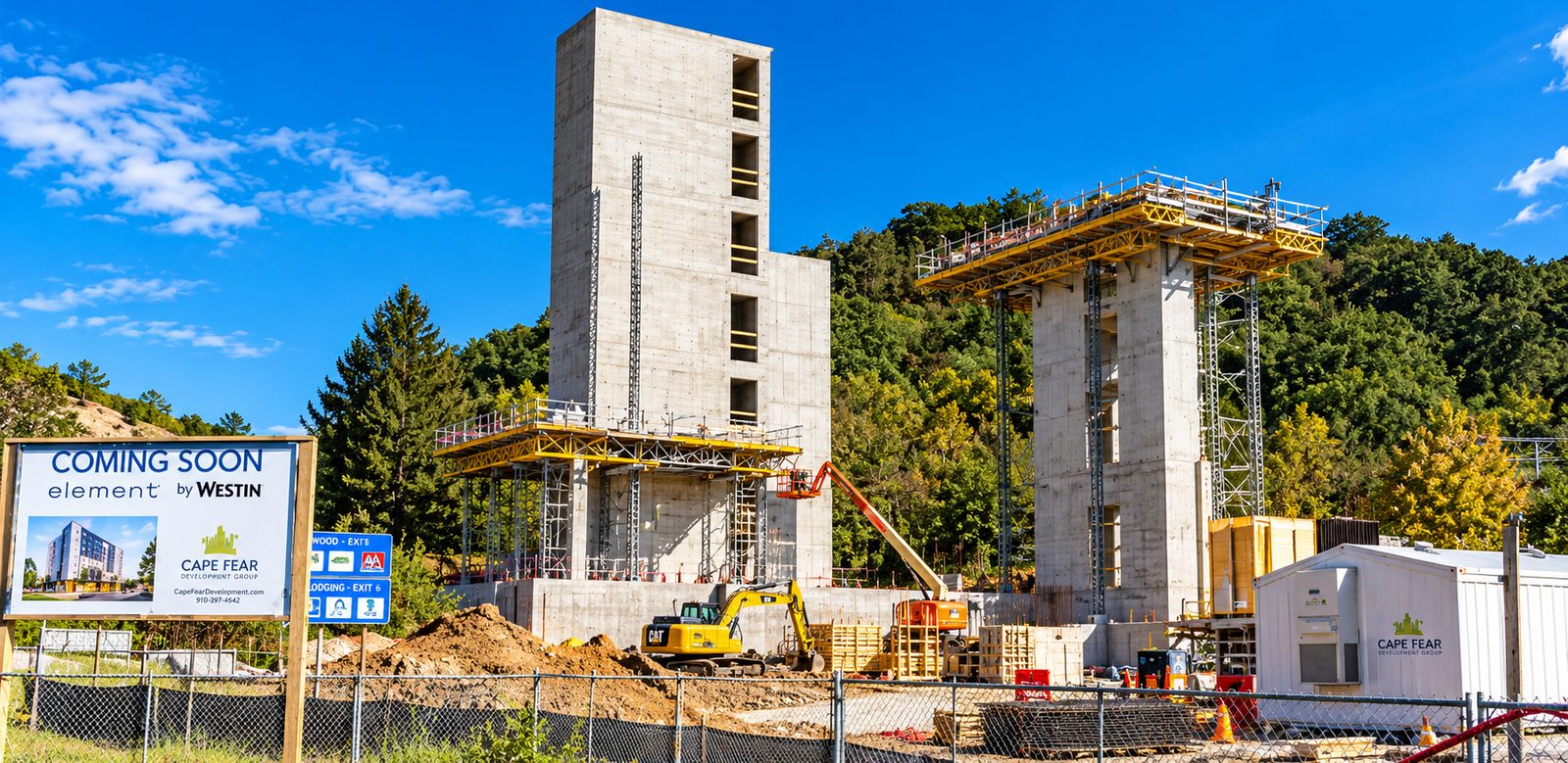 The Element hotel under construction in Asheville, with the Cape Fear Development Group sign and site office